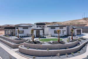 View of front of house with a gazebo and stucco siding