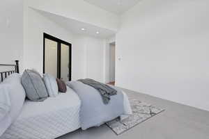 Bedroom with recessed lighting and baseboards