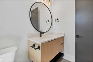 Bathroom with vanity and baseboards