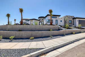View of front of house featuring stucco siding