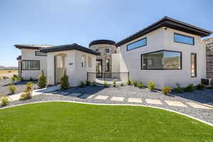 Back of house featuring a standing seam roof