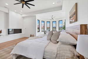 Bedroom with recessed lighting, wood finished floors, a chandelier, and ceiling fan