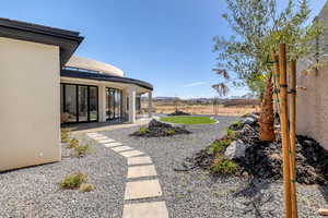 View of yard with a mountain view and a patio area