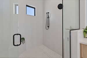 Bathroom featuring a shower stall