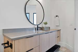 Bathroom featuring vanity and light tile patterned flooring