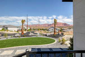 View of yard featuring a residential view and a mountain view