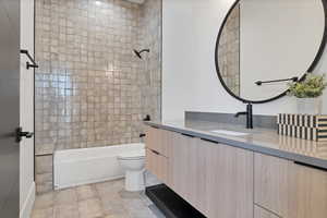 Full bathroom featuring bathing tub / shower combination and vanity