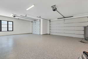 Garage featuring a garage door opener