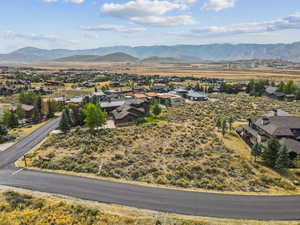 Aerial view of residential area featuring a mountainous background