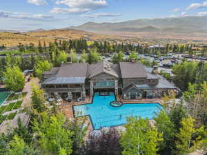 Bird's eye view of a mountain backdrop and a pool area