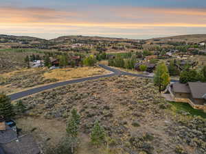 Twilight drone capture showcasing Lot 36’s northeast frontage and broad southwest views.