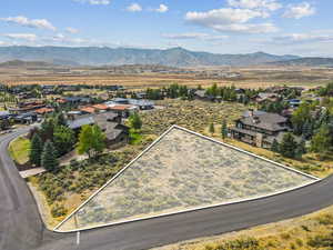 Drone view of The Homesteads with Lot 36 centered under brilliant twilight skies.