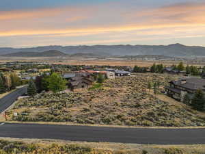A sweeping twilight aerial reveals Lot 36, set against Promontory’s rolling ridgelines and glowing sky.