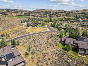 Aerial overview of property's location featuring nearby suburban area