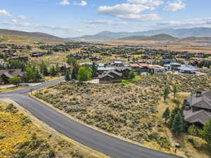 Aerial perspective of suburban area with a mountain backdrop