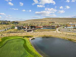 Bird's eye view of a water and mountain view and a golf club