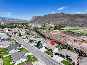 View of property location with a mountain backdrop and nearby suburban area
