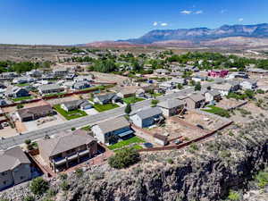 Aerial view of residential area featuring a mountain backdrop
