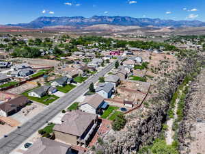 Aerial perspective of suburban area with a mountainous background
