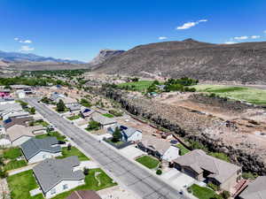 Aerial view of residential area featuring a mountain backdrop