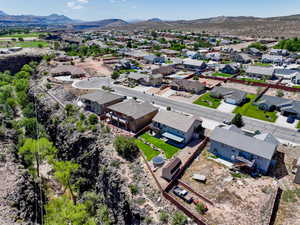 Aerial perspective of suburban area with a mountainous background