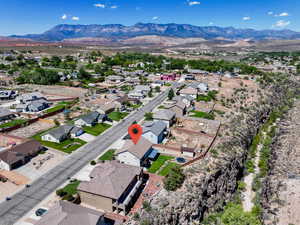 Aerial view of residential area featuring a mountain backdrop