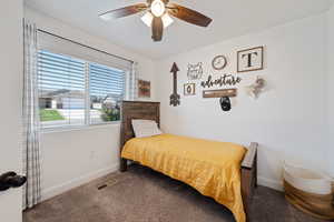 Bedroom featuring carpet and ceiling fan