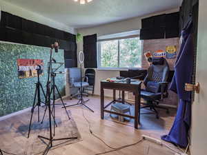 Office space featuring wood finished floors and baseboards