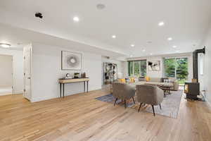 Virtually Staged - Lower level expansive Living Room with gas fireplace 9' ceilings, walkout, engineered wood floor.