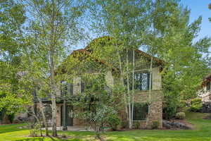 Back side of 1336 N Antibe Lane, Midway, UT 84049 with lower level walk-out patio and main level deck.