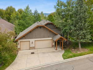 Front of home with 3 car garage.