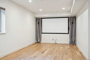 Theatre area - Potentially a art room, bedroom or flex space and has engineered wood flooring