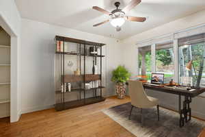 Virtually Staged - Office with wood flooring, french glass doors and large closet.