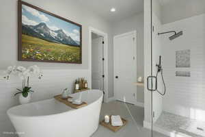 Bathroom with a shower stall, a freestanding tub, light tile patterned floors, and recessed lighting