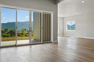 Basement rec room views with accordian doors to exterior patio with Hot tub prewire.