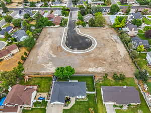 Aerial view of property's location featuring nearby suburban area
