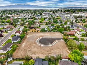 Aerial perspective of suburban area with a mountain backdrop