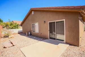 Back of property featuring stucco siding and a patio area