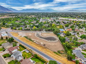 Aerial view of residential area featuring a mountainous background