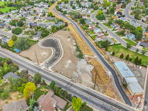 Aerial overview of property's location featuring nearby suburban area