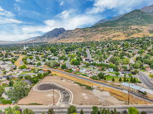 Aerial perspective of suburban area featuring a mountain backdrop