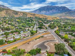 Aerial perspective of suburban area featuring a mountain backdrop