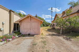 View of shed with a sunroom