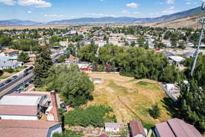 Aerial perspective of suburban area featuring a mountain backdrop