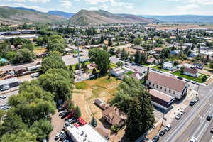 Aerial perspective of suburban area featuring a mountain backdrop