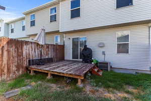 Back of house featuring a wooden deck