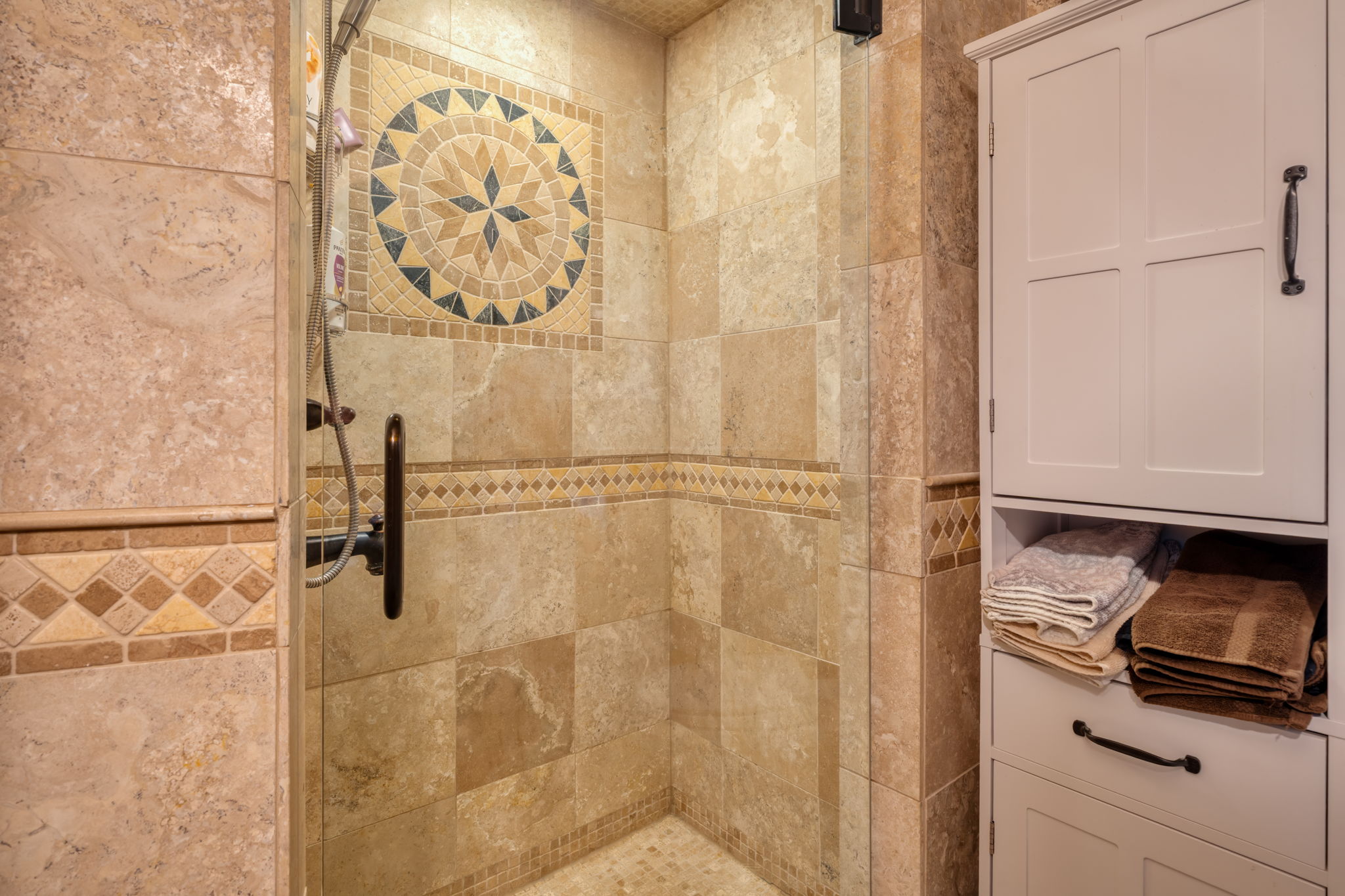 Full bathroom with a stall shower