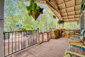 Deck with view of wooded area