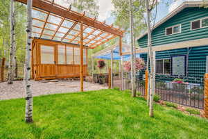 View of yard with an exterior structure and an outbuilding
