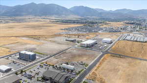 Bird's eye view of a mountain backdrop and industrial structures